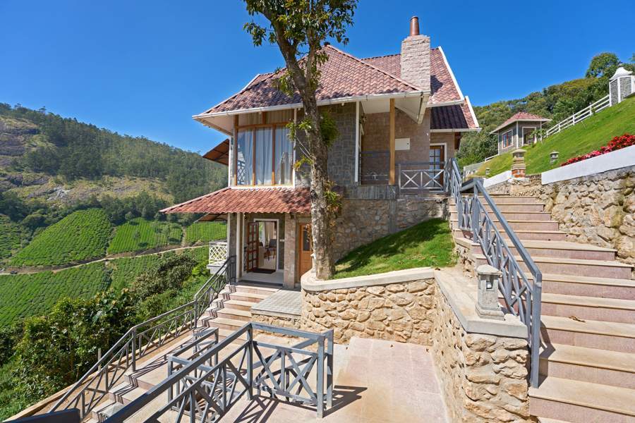 Jacuzzi Room cottage exterior staircase and stone facade