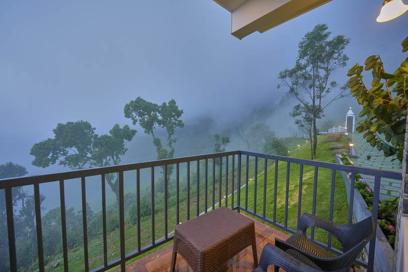 Luxury Suite Room balcony view over the tea gardens at twilight