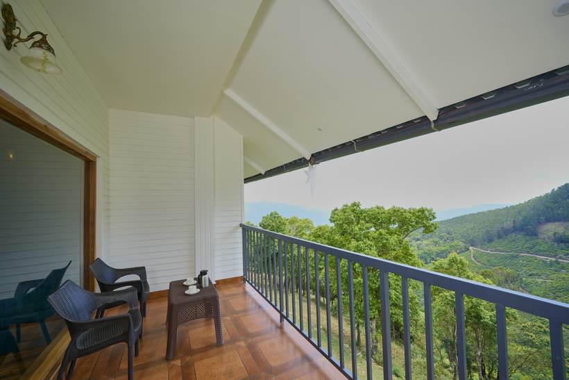 Plantation View Luxury Room private balcony seating overlooking the valley